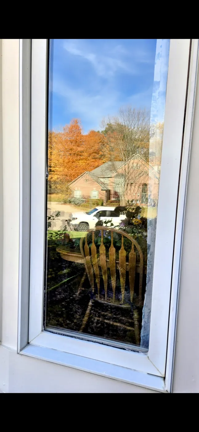 Same window with the hard water stains removed and a clear view restored by Down to Earth