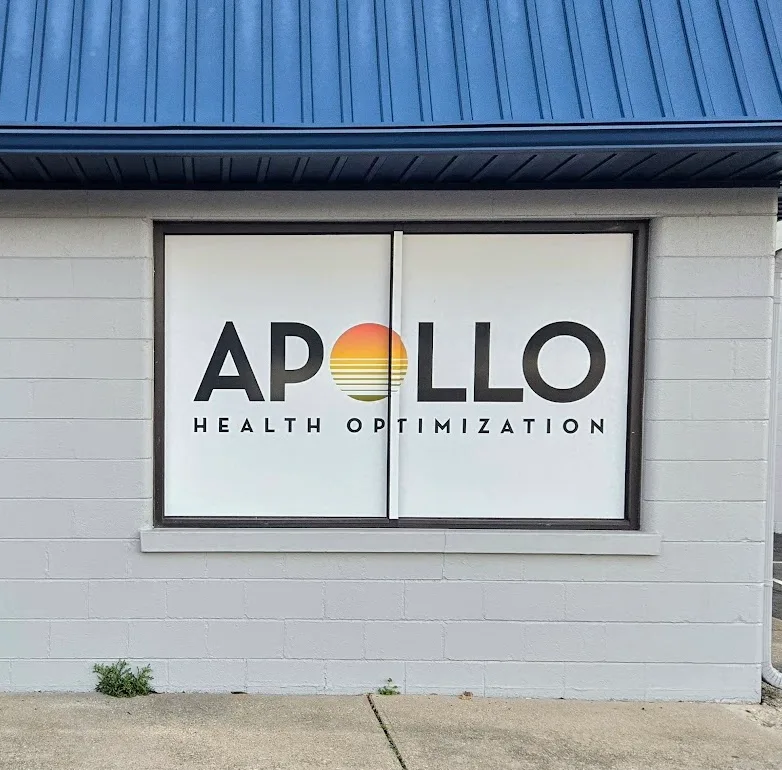 Storefront window with Apollo Health Optimization vinyl lettering still intact, before removal