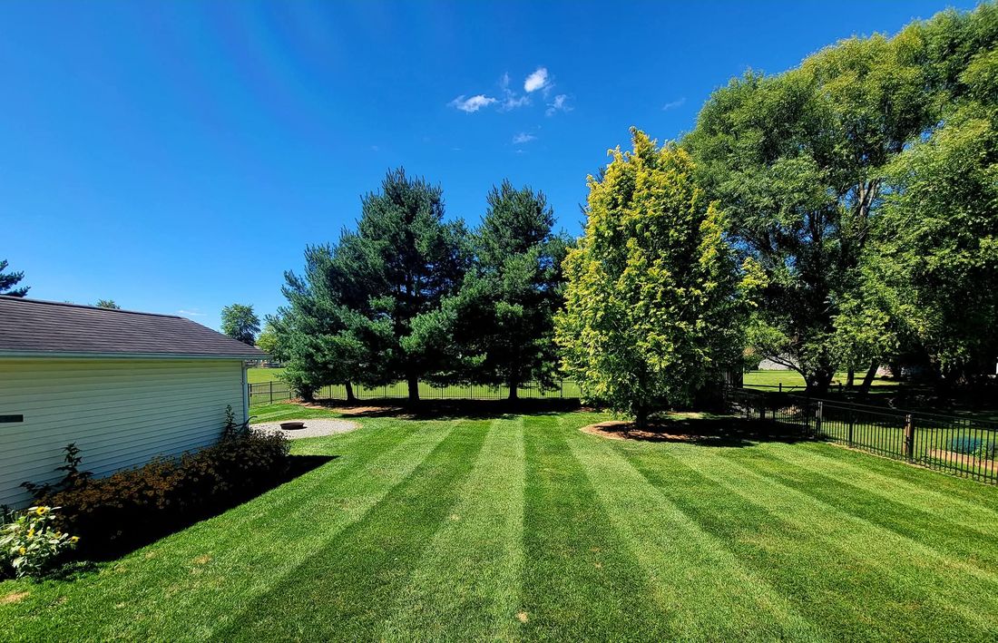Curb-appeal stripe pattern across a residential front lawn near Batavia, Ohio